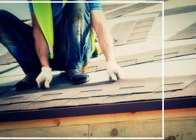 A man fixing a shingle on a roof.