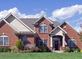 A ~~brick~~ home with a green lawn.