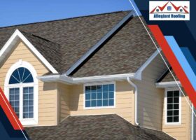 A house with a shingled roof featuring roof ventilation.