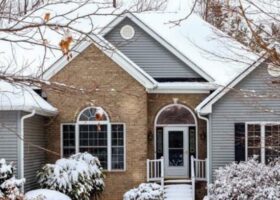 A winter home with snow on the ground.